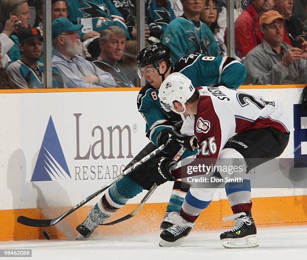 Paul Stastny of the Colorado Avalanche, battles for the puck along the boards with Joe Pavelski of the San Jose Sharks in Game One of the Western...