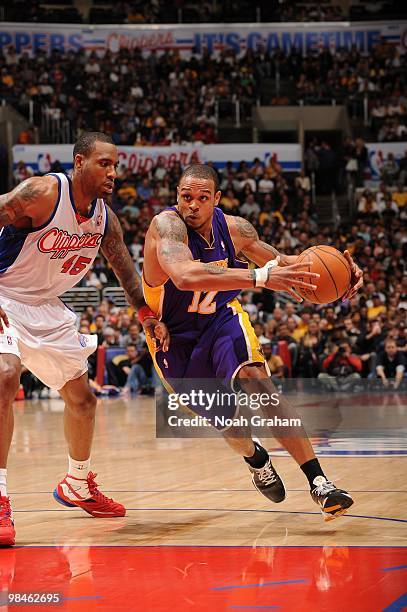 Shannon Brown of the Los Angeles Lakers drives past Rasual Butler of the Los Angeles Clippers at Staples Center on April 14, 2010 in Los Angeles,...
