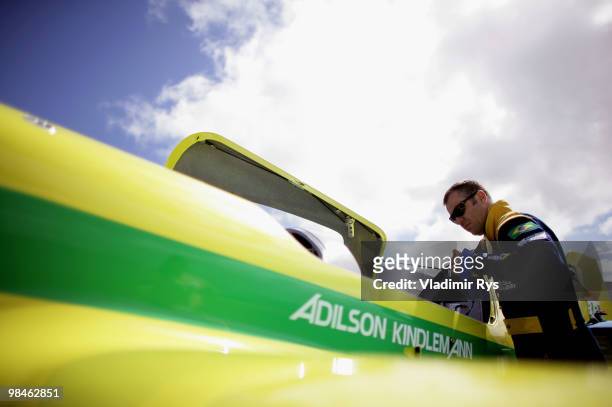 Adilson Kindlemann of Brazil gets into his plane for his Red Bull Air Race Training day practice on April 15, 2010 in Perth, Australia.