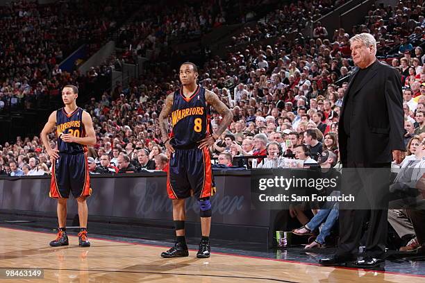 Stephen Curry, Monta Ellis and coach Don Nelson of the Golden State Warriors wait out a technical foul shot during a game against the Portland Trail...