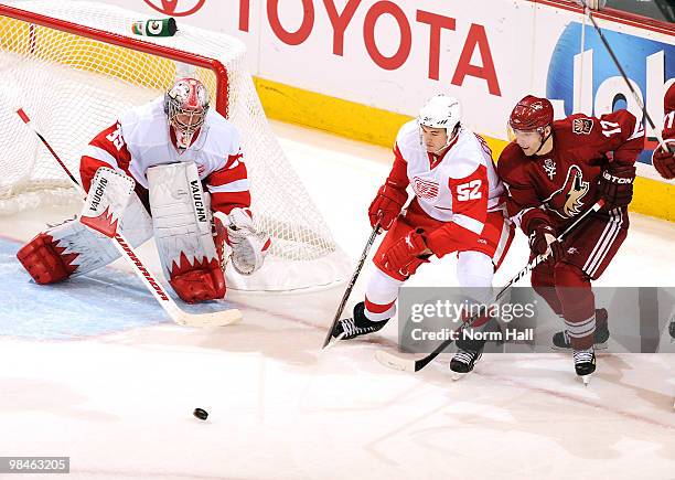 Radim Vrbata of the Phoenix Coyotes and Jonathan Ericsson of the Detroit Red Wings go after the puck in Game One of the Western Conference...