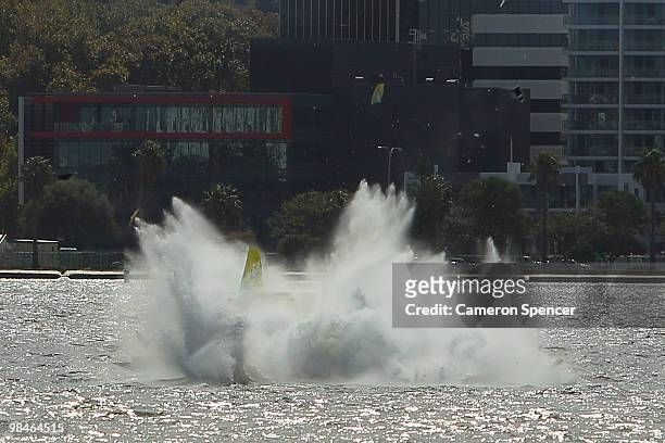 Adilson Kindlemann of Brazil crashes into the Swan River during the Red Bull Air Race Training day on April 15, 2010 in Perth, Australia.