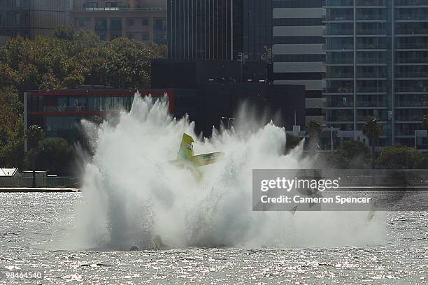 Adilson Kindlemann of Brazil crashes into the Swan River during the Red Bull Air Race Training day on April 15, 2010 in Perth, Australia.