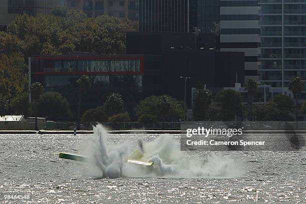 Adilson Kindlemann of Brazil crashes into the Swan River during the Red Bull Air Race Training day on April 15, 2010 in Perth, Australia.