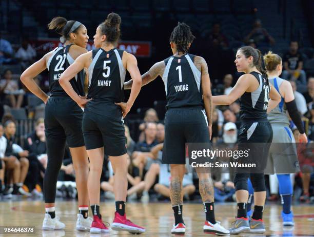 Ja Wilson, Dearica Hamby, Tamera Young and Kelsey Plum of the Las Vegas Aces stand on the court during their game against the Minnesota Lynx at the...