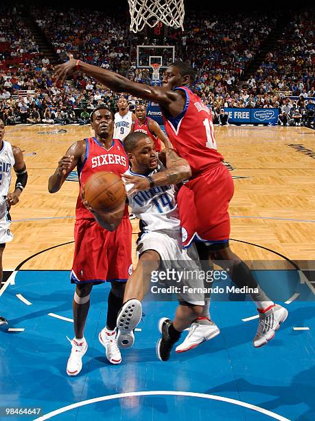 Jameer Nelson of the Orlando Magic moves the ball against Jrue Holiday of the Philadelphia 76ers during the game on April 14, 2010 at Amway Arena in...