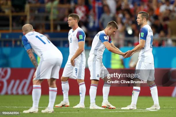 Gylfi Sigurdsson of Iceland consoles teammate Johann Gudmundsson of Iceland after their sides defeat in the 2018 FIFA World Cup Russia group D match...