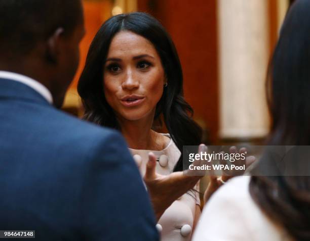 Meghan, Duchess of Sussex meets group of leaders during the Queen's Young Leaders Awards Ceremony at Buckingham Palace on June 26, 2018 in London,...