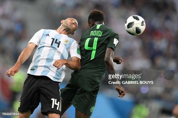 Argentina's midfielder Javier Mascherano and Nigeria's midfielder Onyinye Ndidi compete for the ball during the Russia 2018 World Cup Group D...