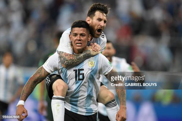 Argentina's defender Marcos Rojo celebrates his goal with Argentina's forward Lionel Messi during the Russia 2018 World Cup Group D football match...