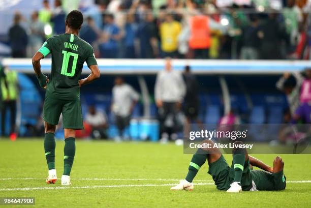 Odion Ighalo of Nigeria lies on the floor dejected as John Obi Mikel walks off during the 2018 FIFA World Cup Russia group D match between Nigeria...