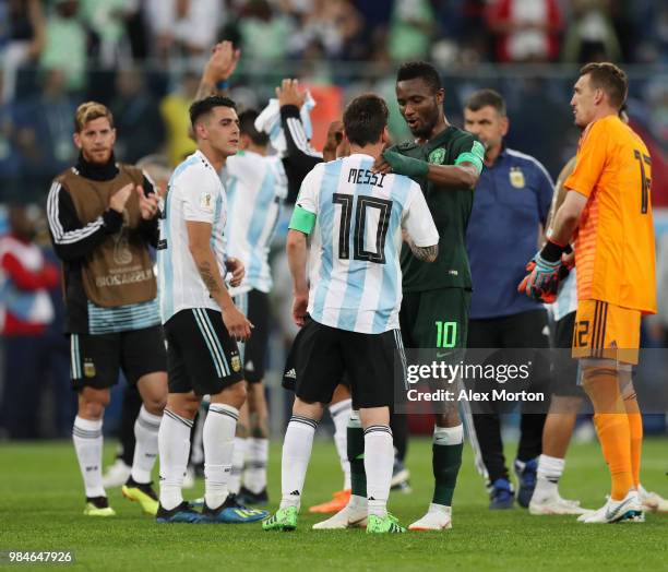 Lionel Messi of Argentina talks to John Obi Mikel of Nigeria following the 2018 FIFA World Cup Russia group D match between Nigeria and Argentina at...