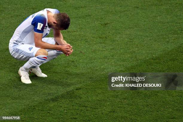 Iceland's midfielder Gylfi Sigurdsson reacts at the end of the Russia 2018 World Cup Group D football match between Iceland and Croatia at the Rostov...