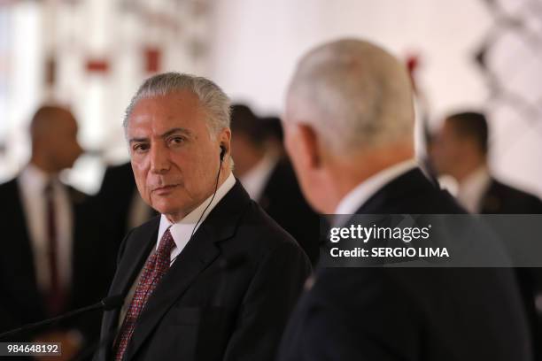 Vice President Mike Pence speaks next to Brazilian President Michel Temer during a press statement at Itamaray Palace in Brasilia, on June 26, 2018....