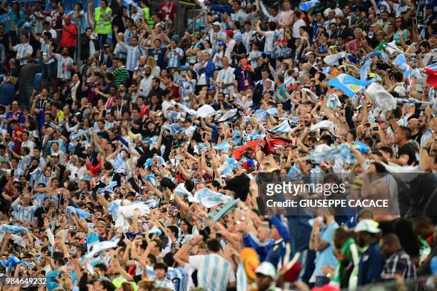 Argentina supporters cheer during the Russia 2018 World Cup Group D football match between Nigeria and Argentina at the Saint Petersburg Stadium in...