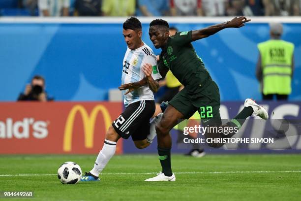 Argentina's midfielder Cristian Pavon is marked by Nigeria's defender Kenneth Omeruo during the Russia 2018 World Cup Group D football match between...