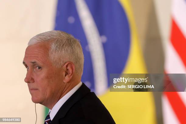 Vice President Mike Pence gestures during a press statement with Brazilian President Michel Temer at Itamaray Palace in Brasilia, on June 26, 2018. -...