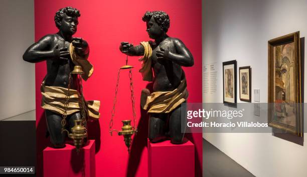 Religious sculptures and paintings on display at "Na Rota Das Catedrais - Construcoes E Identidades" exhibition in D. Luis I gallery of Palacio...