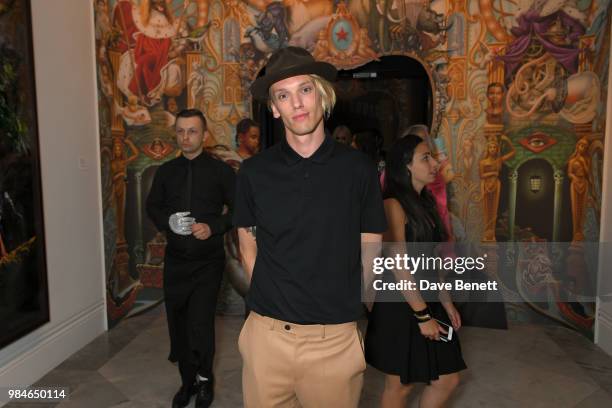 Jamie Campbell Bower attends a private view of the "Michael Jackson: On The Wall" exhibition sponsored by HUGO BOSS at the National Portrait Gallery...