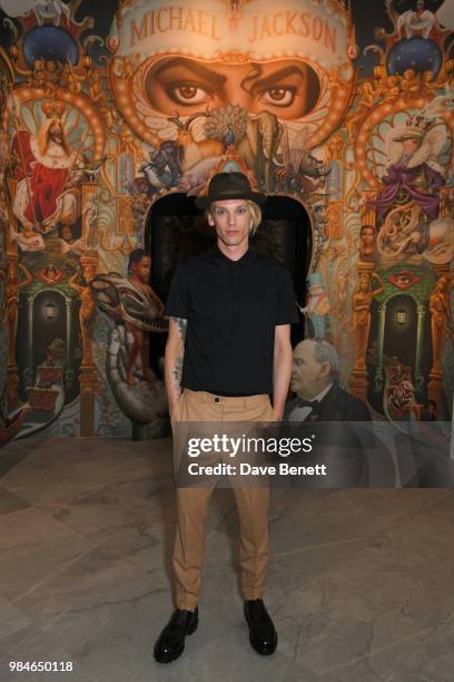 Jamie Campbell Bower attends a private view of the "Michael Jackson: On The Wall" exhibition sponsored by HUGO BOSS at the National Portrait Gallery...