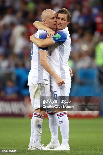 Olafur Skulason of Iceland consoles Emil Hallfredsson of Iceland following their sides defeat in the 2018 FIFA World Cup Russia group D match between...