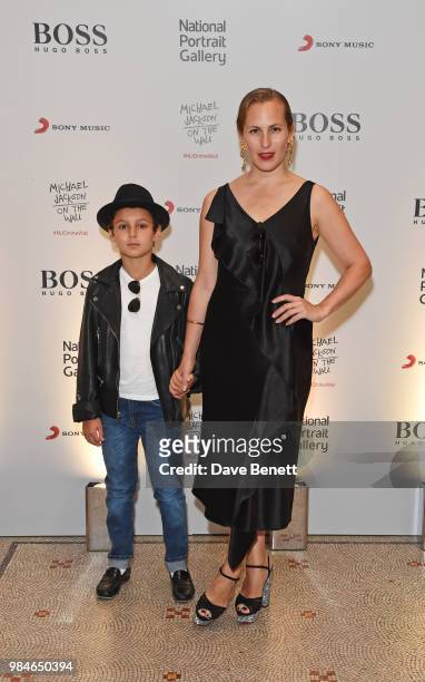 Charlotte Dellal and son attend a private view of the "Michael Jackson: On The Wall" exhibition sponsored by HUGO BOSS at the National Portrait...