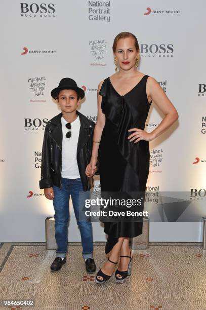 Charlotte Dellal and son attend a private view of the "Michael Jackson: On The Wall" exhibition sponsored by HUGO BOSS at the National Portrait...