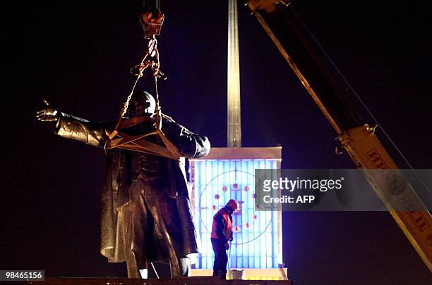 Crane lifts a statue of Soviet leader Vladimir Lenin in St. Petersburg early on April 15, 2010. The monument, which was demaged by an explosion in...