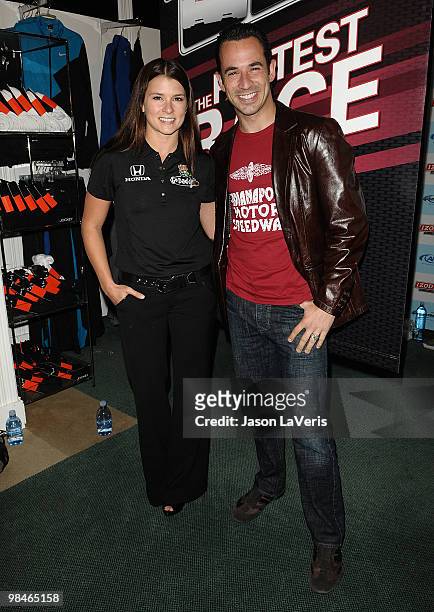 Auto racing drivers Danica Patrick and Helio Castroneves attend the Grand Prix kickoff event at Macy's South Coast Plaza on April 14, 2010 in Costa...