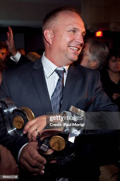 Musician and honoree Garth Brooks with his award at the GRAMMYs on the Hill awards at The Liaison Capitol Hill Hotel on April 14, 2010 in Washington,...