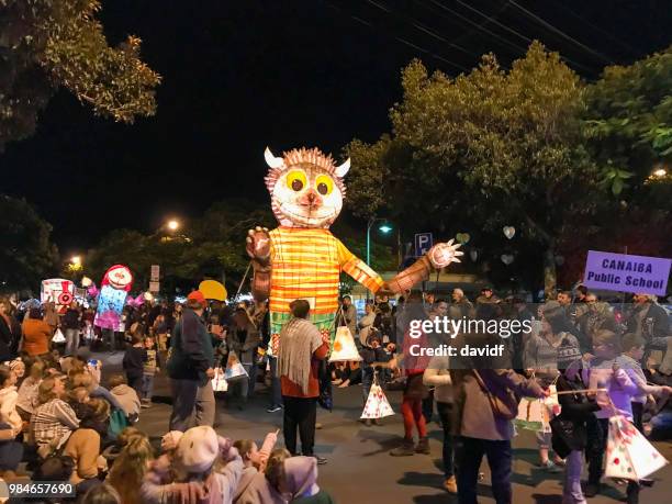 crowds gathered to watch the lismore lantern parade community event - lantern stock pictures, royalty-free photos & images