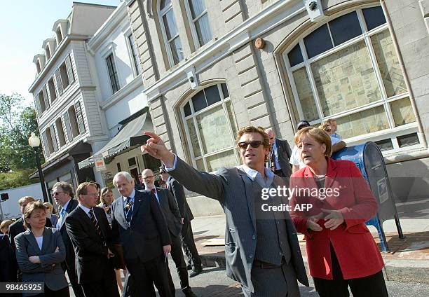 German Chancellor Angela Merkel tours the Warner Brothers studios with Australian actor Simon Baker in Los Angeles, California, on April 14, 2010....