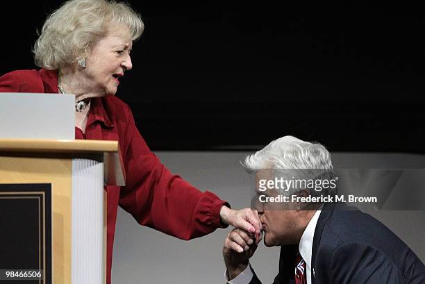 Jay Leno kisses the kind of actress Betty White during the American Women in Radio and Television 2010 Genii Awards at the Skirball Cultural Center...
