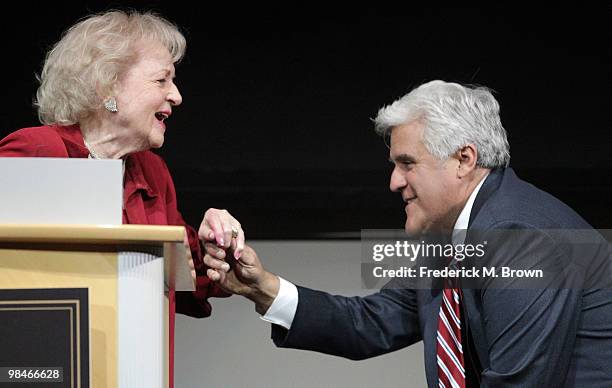 Jay Leno kisses the kind of actress Betty White during the American Women in Radio and Television 2010 Genii Awards at the Skirball Cultural Center...