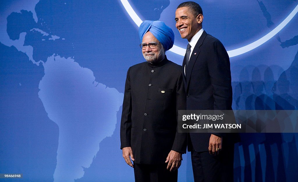 US President Barack Obama (R) greets the