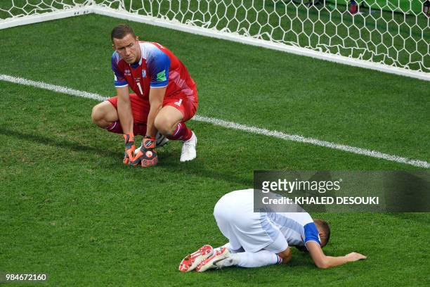 Iceland's goalkeeper Hannes Halldorsson and Iceland's defender Ragnar Sigurdsson react after Croatia's goal during the Russia 2018 World Cup Group D...