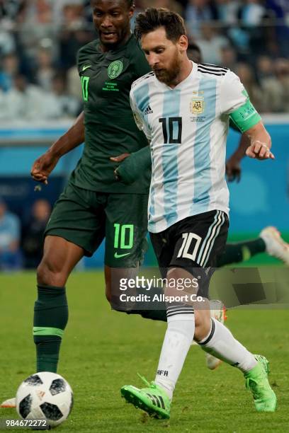 Lionel Messi of Argentina is checked by John Obi Mikel of Nigeria during the 2018 FIFA World Cup Russia group D match between Nigeria and Argentina...