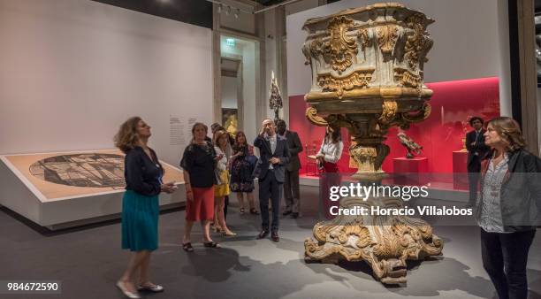 Visitors are briefed on "Na Rota Das Catedrais - Construcoes E Identidades" exhibition in D. Luis I gallery of Palacio Nacional da Ajuda on June 26,...