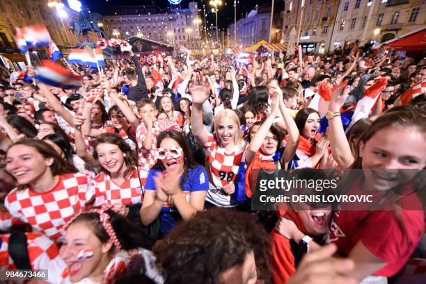 Croatia's fans celebrate a goal as they watch on a giant screen the Russia 2018 World Cup Group D football match between Iceland and Croatia in...
