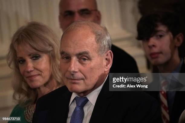White House Chief of Staff John Kelly and Counselor to the President Kellyanne Conway listen during an East Room Medal of Honor ceremony for U.S....