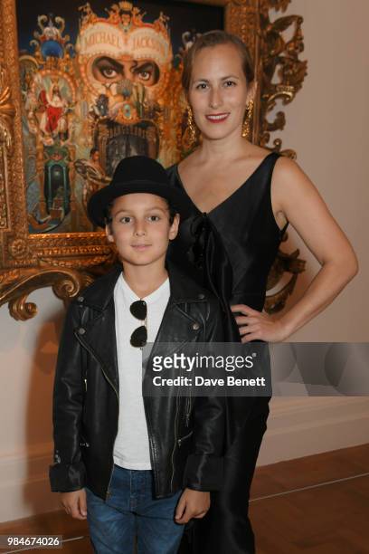 Charlotte Dellal and son attends a private view of the "Michael Jackson: On The Wall" exhibition sponsored by HUGO BOSS at the National Portrait...