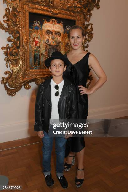 Charlotte Dellal and son attends a private view of the "Michael Jackson: On The Wall" exhibition sponsored by HUGO BOSS at the National Portrait...