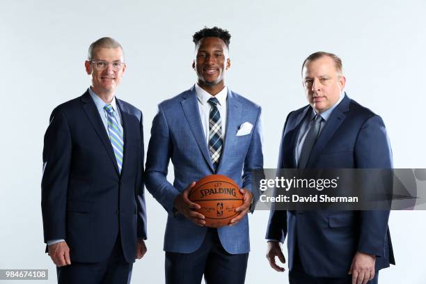 General manager Scott Layden, Josh Okogie, and head coach Tom Thibodeau of the Minnesota Timberwolves pose for a portrait on June 26, 2018 at the...