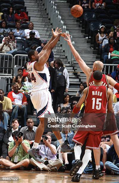 Jason Collins of the Atlanta Hawks puts up a shot against the Cleveland Cavaliers on April 14, 2010 at Philips Arena in Atlanta, Georgia. NOTE TO...