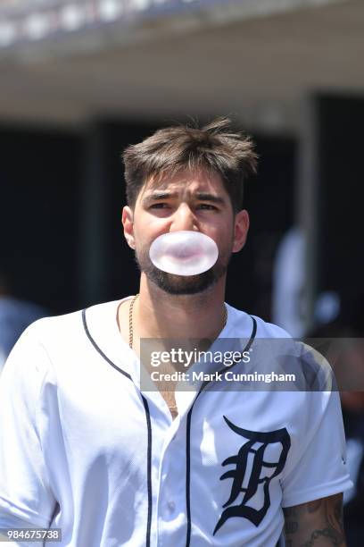 Nicholas Castellanos of the Detroit Tigers looks on while blowing a bubble during the game against the Minnesota Twins at Comerica Park on June 14,...