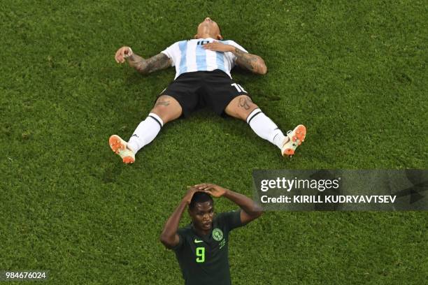 Nigeria's forward Odion Jude Ighalo and Argentina's defender Marcos Rojo react during the Russia 2018 World Cup Group D football match between...