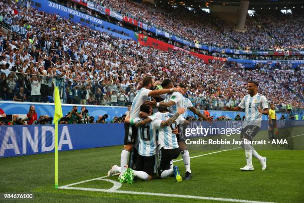 Lionel Messi of Argentina celebrates with team-mates after scoring a goal to make it 0-1 during the 2018 FIFA World Cup Russia group D match between...