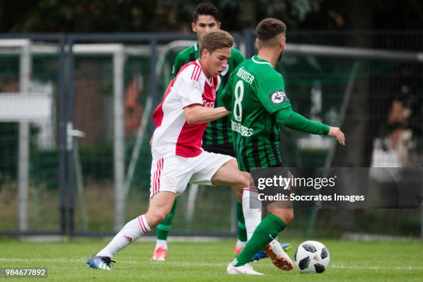 Carel Eiting of Ajax, Kevin Rodrigues of Preussen Munster during the match between Preussen Munster v Ajax at the Sportplatz Klosterpforte on June...