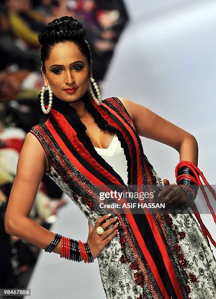 Model presents a creation by Pakistani designer Ahmed Bilal on the last day of the Karachi Fashion Week on April 9, 2010. The event is scheduled to...