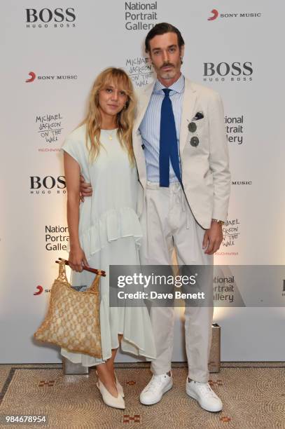 Melissa Tarling and Richard Biedul attend a private view of the "Michael Jackson: On The Wall" exhibition sponsored by HUGO BOSS at the National...